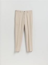 Garniturowe spodnie slim fit - beżowy. Brązowe garnitury męskie Reserved, bez wzorów, z tkaniny. Za 169.99 zł.