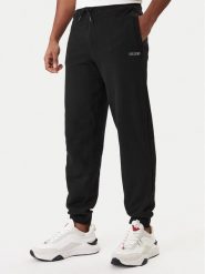 Guess Spodnie dresowe Z6RB12 KAIJ1 Czarny Regular Fit. Czarne spodnie sportowe męskie Guess, m, z aplikacjami, z bawełny. Za 299.99 zł.