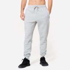 Spodnie fitness męskie Domyos Gym & Pilates slim. Szare spodnie sportowe męskie DOMYOS, m, bez wzorów, z dresówki, na fitness i siłownię. Za 79.99 zł.