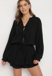 Czarny Wiązany Bawełniany Kombinezon Boho z Falbankami i Wiązaniem Lalelia. Czarne sukienki damskie Born2be, na co dzień, na lato, uniwersalny, bez wzorów, z bawełny, boho, bez kołnierzyka, bez ramiączek, proste. Za 159.99 zł.