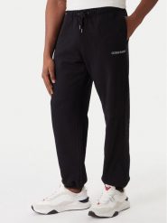 Guess Jeans Spodnie dresowe M6RB70 KCPR1 Czarny Regular Fit. Czarne spodnie sportowe męskie Guess Jeans, m, z aplikacjami, z bawełny. Za 299.99 zł.