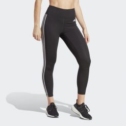 Legginsy treningowe z wysokim stanem Train Essentials 3-Stripes 7/8. Czarne legginsy damskie Adidas, bez wzorów, z materiału. Za 229.00 zł.