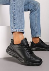 Czarne Klasyczne Płaskie Buty Sportowe Sneakersy z Tłoczoną Podeszwą Velandria. Czarne obuwie sportowe damskie Born2be, bez wzorów, z bawełny, bez zapięcia. Za 119.99 zł.