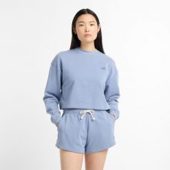 Bluza damska New Balance WT51514DUS – niebieska. Niebieskie bluzy damskie New Balance, s, z aplikacjami, z bawełny, klasyczne, bez ramiączek, bez kaptura. Za 249.99 zł.