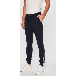 Calvin Klein Jeans - Spodnie. Niebieskie spodnie materiałowe męskie Calvin Klein Jeans, bez wzorów, z bawełny. W wyprzedaży za 199.90 zł.