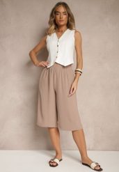 Ciemnobeżowe Luźne Spodnie 3/4 z Kieszonkami Efrinea. Brązowe spodnie materiałowe damskie Renee, bez wzorów, z gumy, eleganckie. Za 34.99 zł.