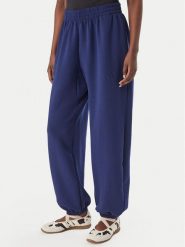 Adidas Spodnie dresowe Soft Lux KS7879 Niebieski Loose Fit. Niebieskie spodnie dresowe damskie Adidas, bez wzorów, z dresówki. Za 329.99 zł.