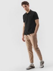 4F Spodnie casual joggery męskie - beżowe M. Brązowe spodnie materiałowe męskie 4F, bez wzorów, z bawełny. W wyprzedaży za 89.99 zł.