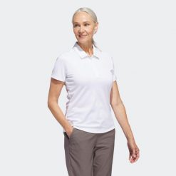 Koszulka polo do golfa damska ADIDAS. Bluzki damskie Adidas, s, bez wzorów, klasyczne, bez kołnierzyka, bez ramiączek. Za 209.99 zł.