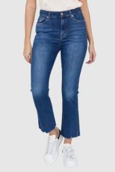 7 FOR ALL MANKIND Ciemnoniebieskie jeansy damskie z poszarpanymi nogawkami HW Slim Kick. Niebieskie jeansy damskie 7 for all mankind, bez wzorów, z bawełny. W wyprzedaży za 499.99 zł.