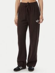 Adidas Spodnie dresowe Essentials IA4437 Brązowy Loose Fit. Brązowe spodnie dresowe damskie Adidas, bez wzorów, z bawełny. Za 298.99 zł.