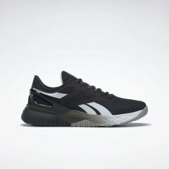 Obuwie Sportowe Damskie Reebok Nanoflex TR W Czarny. Białe obuwie sportowe damskie Reebok, bez wzorów, z gumy, bez zapięcia, na fitness i siłownię. Za 367.00 zł.