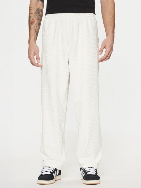 Adidas Spodnie dresowe Monogram Track JP4429 Biały Regular Fit. Białe komplety dresowe męskie Adidas, l, bez wzorów, z dresówki. Za 199.99 zł.