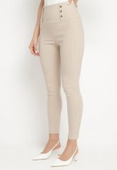 Jasnobeżowe Legginsy z Wysokim Stanem Ozdobione Guzikami Kolithra. Brązowe legginsy damskie Born2be, bez wzorów, z jeansu. Za 39.99 zł.