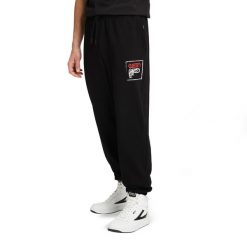 Spodnie męskie FILA Luton Track. Czarne komplety dresowe męskie Fila, m, bez wzorów, z dresówki. Za 159.99 zł.