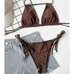 Strój kąpielowy z zapięciem na szyi do pływania i opalania Gulten. Brązowe stroje kąpielowe damskie Intica, l, bez wzorów, z materiału. Za 149.00 zł.