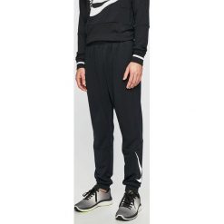 Nike - Spodnie. Szare spodnie sportowe męskie Nike, m, bez wzorów, z materiału. W wyprzedaży za 149.90 zł.