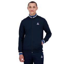 Kurtka z dresu Le Coq Sportif Heritage SP N°1. Niebieskie kurtki sportowe męskie le coq sportif, uniwersalny, bez wzorów, z dresówki, bez kaptura, do biegania. Za 367.10 zł.
