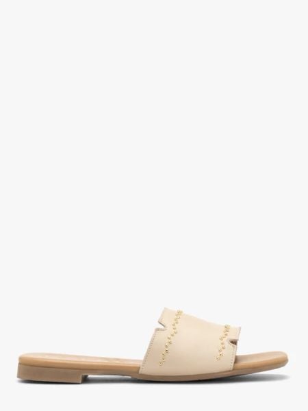 Kremowe skórzane klapki damskie. Brązowe klapki damskie Ryłko, bez wzorów, ze skóry, eleganckie, bez obcasa, na płaskiej podeszwie, bez zapięcia. Za 329.99 zł.