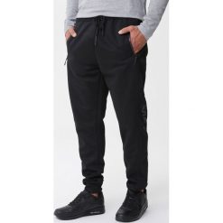 Czarne Spodnie Orrin. Czarne spodnie sportowe męskie Born2be, l, bez wzorów, z dzianiny, climacool (adidas). Za 49.99 zł.