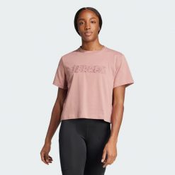 Koszulka Terrex Graphic. Czerwone bluzki damskie Adidas, xs, bez wzorów, z bawełny, sportowe, bez kołnierzyka, bez ramiączek. W wyprzedaży za 95.40 zł.
