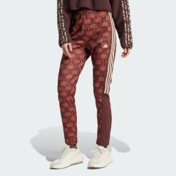 Spodnie dresowe adidas x FARM Rio Tiro. Niebieskie spodnie dresowe damskie Adidas, bez wzorów, z dresówki, sportowe. Za 243.99 zł.