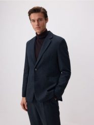 Marynarka slim fit z domieszką wełny - granatowy. Niebieskie garnitury męskie Reserved, bez wzorów, z tkaniny. W wyprzedaży za 159.99 zł.