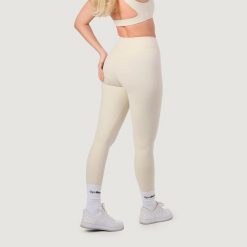 Legginsy damskie fitness z wysokim stanem NEO Almond. Brązowe legginsy damskie GYMBEAM, s, bez wzorów, z elastanu, z podwyższonym stanem, na fitness i siłownię. Za 112.90 zł.