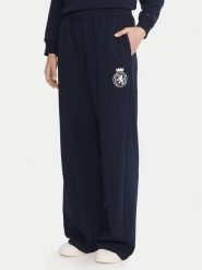 Tommy Hilfiger Spodnie dresowe UW0UW06081 Granatowy Wide Leg. Niebieskie spodnie dresowe damskie Tommy Hilfiger, bez wzorów, z bawełny. Za 279.99 zł.