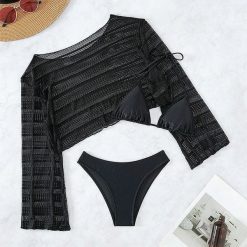 Komplet plażowy z ażurową narzutką i bikini na lato Tressa. Czarne bikini Intica, w ażurowe wzory. W wyprzedaży za 169.00 zł.