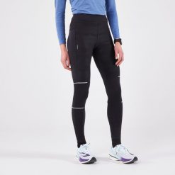 Legginsy do biegania damskie Kiprun Warm Rain ocieplane. Czarne legginsy damskie KIPRUN, bez wzorów, z elastanu. Za 189.99 zł.