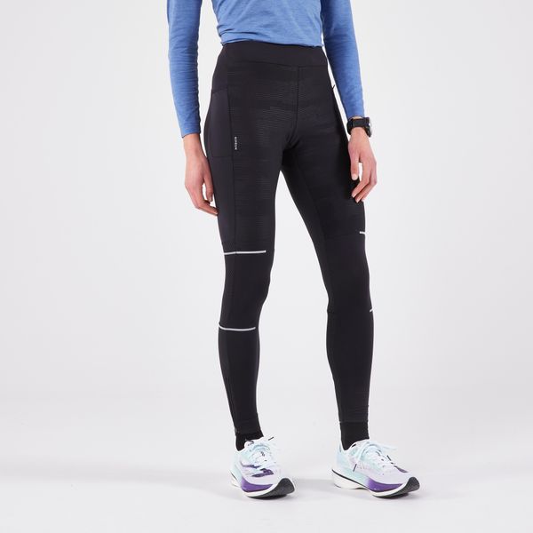 Legginsy do biegania damskie Kiprun Warm Rain ocieplane. Czarne legginsy damskie KIPRUN, bez wzorów, z elastanu. Za 189.99 zł.