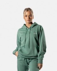 Damska bluza z kapturem 365 oversize z kieszenią kangurką – ciemnozielony. Zielone bluzy damskie AESTHETIC WOLF, s, bez wzorów, z bawełny, klasyczne, bez ramiączek, z kapturem. Za 159.99 zł.