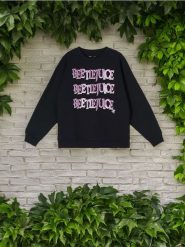 Bluza Beetlejuice - czarny. Czarne bluzy damskie Sinsay, l, bez wzorów, bez ramiączek, bez kaptura. W wyprzedaży za 24.99 zł.