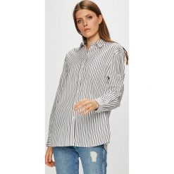 Tommy Jeans - Koszula. Białe koszule damskie Tommy Jeans, s, bez wzorów, z bawełny, casualowe, bez kołnierzyka, bez ramiączek. W wyprzedaży za 229.90 zł.