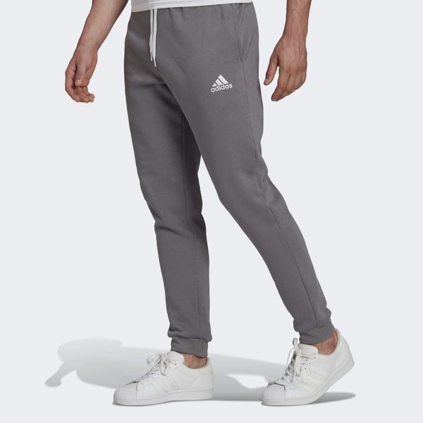 Spodnmie do piłki nożnej męskie Adidas Entrada 22 Sweat Pants. Szare spodnie sportowe męskie Adidas, m, bez wzorów, z dresówki, do piłki nożnej. Za 129.00 zł.
