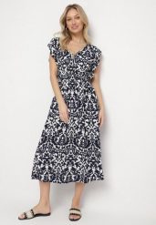 Granatowa Bawełniana Sukienka Rozkloszowana z Falbankami w Ornamentalny Wzór Zaliette. Niebieskie sukienki damskie Born2be, na co dzień, l, bez wzorów, z bawełny, eleganckie, bez kołnierzyka, bez ramiączek, midi, rozkloszowane. Za 49.99 zł.