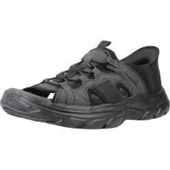 Sandały SKECHERS SLIP-INS REVOLTED SS Czarny. Czarne buty zimowe męskie Skechers, bez wzorów, z syntetyku, sportowe, bez zapięcia. Za 336.99 zł.