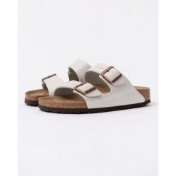 Klapki Birkenstock Arizona Birko Flor Damskie. Białe klapki damskie Birkenstock, bez wzorów, z materiału, eleganckie, bez obcasa, bez zapięcia. Za 531.75 zł.