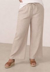 Beżowe Spodnie Casual Szerokie ze Sznurkiem i Gumką w Pasie Caeena. Brązowe spodnie materiałowe damskie Born2be, bez wzorów, z jeansu, casualowe, plus size, długie. Za 79.99 zł.