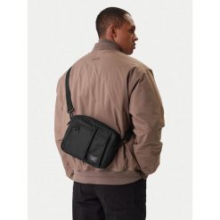 Saszetka Guess Jeans. Czarne saszetki i nerki męskie Guess Jeans, z jeansu, małe. Za 229.99 zł.