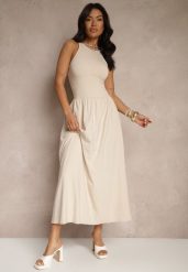 Jasnobeżowa Rozkloszowana Sukienka z Bawełny z Kieszeniami Lirevane. Brązowe sukienki damskie Renee, na co dzień, l, bez wzorów, z bawełny, eleganckie, bez kołnierzyka, bez ramiączek, maxi, rozkloszowane. Za 99.99 zł.