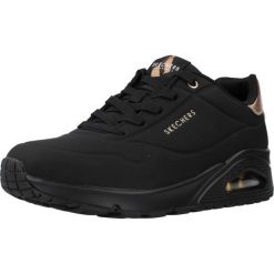 Tenisówki Skechers Model Uno Kolor Czarny. Czarne trampki i tenisówki damskie Skechers, bez wzorów, z gumy, bez zapięcia. Za 349.99 zł.
