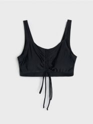 Góra od bikini z marszczeniem i regulowanym wiązaniem z przodu - czarny. Czarne stroje kąpielowe damskie Sinsay, xl, bez wzorów. Za 49.99 zł.