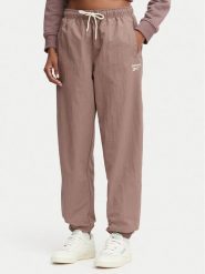 Reebok Spodnie dresowe Kalina RK25694CCW - LIGHT COCOA/LINEN Brązowy Relaxed Fit. Brązowe spodnie dresowe damskie Reebok, bez wzorów, z dresówki. Za 259.99 zł.