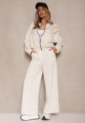 Jasnobeżowy Komplet Dresowy z Wiskozą Spodnie o Szerokim Kroju i Bluza z Broszką Redaella. Brązowe bluzy damskie Renee, z aplikacjami, z dresówki, casualowe, bez ramiączek, bez kaptura. Za 179.99 zł.