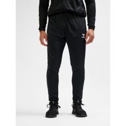 SPODNIE hmlESSENTIAL TRAINING PANTS. Czarne spodnie dresowe damskie Hummel, bez wzorów, z dresówki, sportowe. Za 150.00 zł.