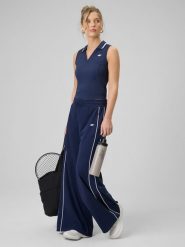 4F Spodnie dresowe z szerokimi nogawkami damskie - granatowe L. Niebieskie spodnie dresowe damskie 4F, bez wzorów, z bawełny, z podwyższonym stanem, długie. Za 159.99 zł.