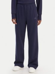 DKNY Sport Spodnie dresowe DP6P3795 Granatowy Regular Fit. Niebieskie spodnie dresowe damskie DKNY Sport, bez wzorów, z bawełny, sportowe. Za 309.99 zł.