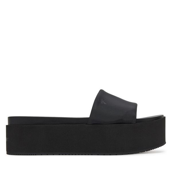 Klapki Calvin Klein Jeans. Czarne klapki damskie Calvin Klein Jeans, bez wzorów, z jeansu, bez obcasa, bez zapięcia. Za 199.99 zł.